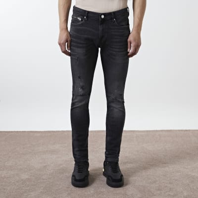 black ripped skinny jeans river island