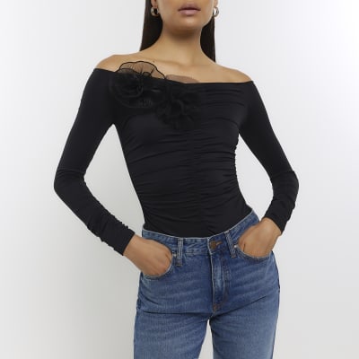 Black ruched corsage detail bodysuit | River Island