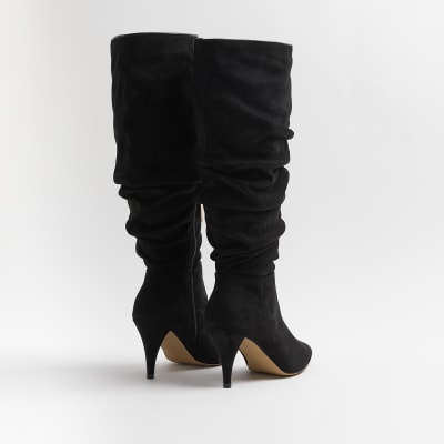 Black ruched knee high heeled boots