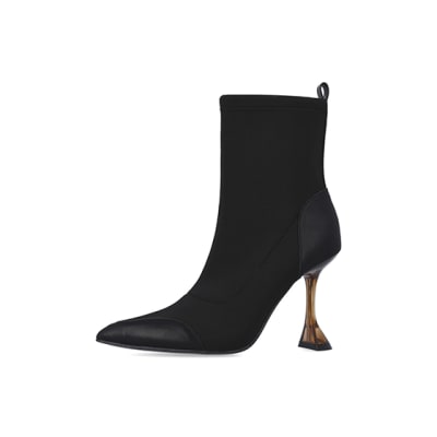 360 degree animation of product Black scuba flared heeled ankle boots frame-2