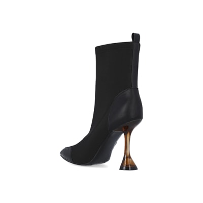360 degree animation of product Black scuba flared heeled ankle boots frame-6