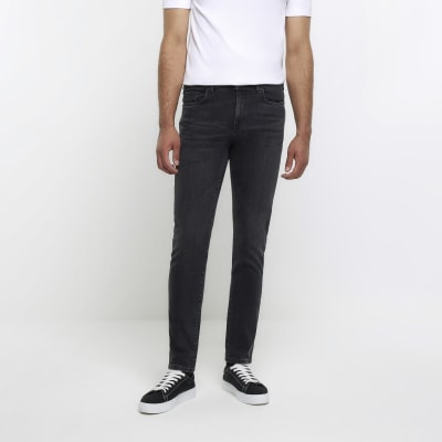 Black ripped skinny jeans best sale river island