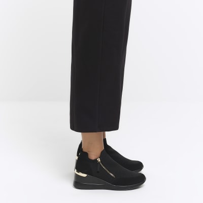 Black slip on wedge trainers River Island