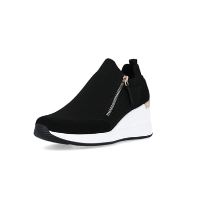 360 degree animation of product Black slip on wedge trainers frame-0