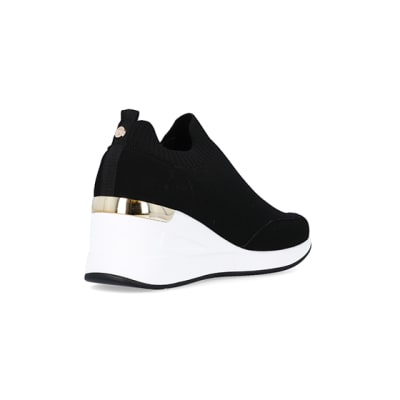 360 degree animation of product Black slip on wedge trainers frame-12