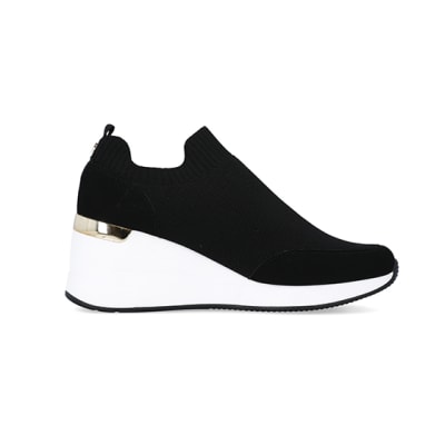 360 degree animation of product Black slip on wedge trainers frame-15