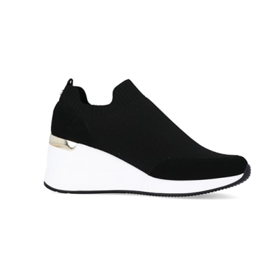360 degree animation of product Black slip on wedge trainers frame-16