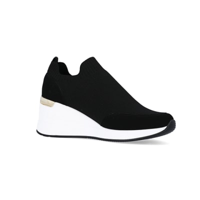 360 degree animation of product Black slip on wedge trainers frame-17