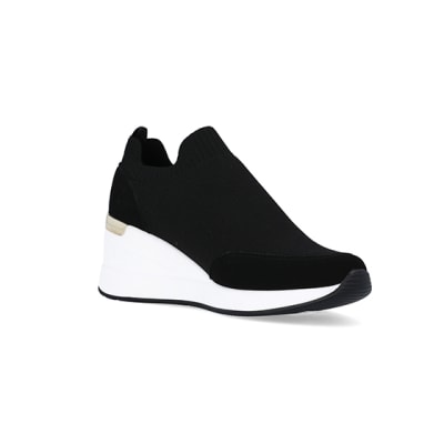 360 degree animation of product Black slip on wedge trainers frame-18