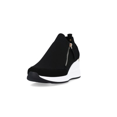 360 degree animation of product Black slip on wedge trainers frame-23