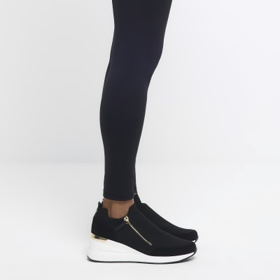 Black slip on wedge trainers River Island