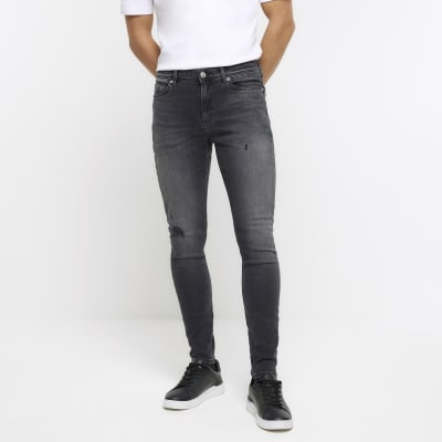 ASOS DESIGN super skinny jeans in mid wash blue with abrasions