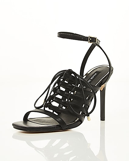 360 degree animation of product Black strappy lace up heel sandals frame-0