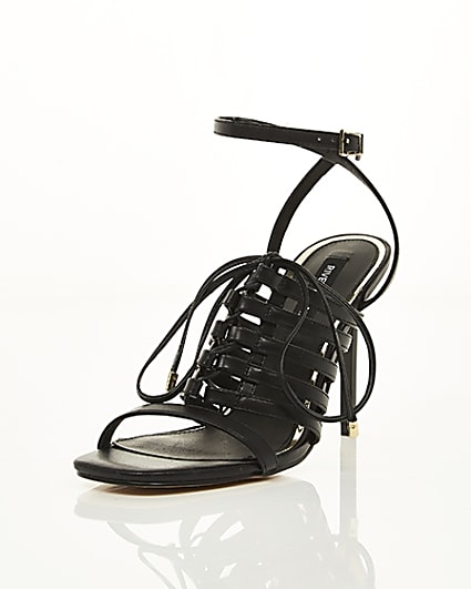 360 degree animation of product Black strappy lace up heel sandals frame-1