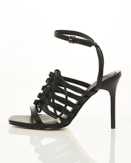 360 degree animation of product Black strappy lace up heel sandals frame-21