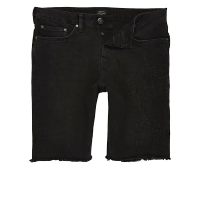 Black stretch denim western chain shorts