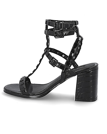 360 degree animation of product Black studded gladiator block heel sandals frame-4