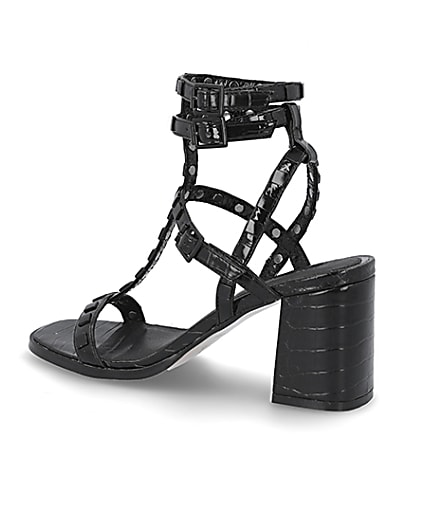 360 degree animation of product Black studded gladiator block heel sandals frame-5