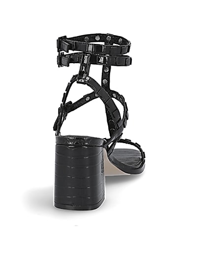 360 degree animation of product Black studded gladiator block heel sandals frame-10