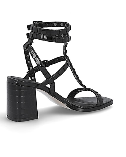 360 degree animation of product Black studded gladiator block heel sandals frame-13