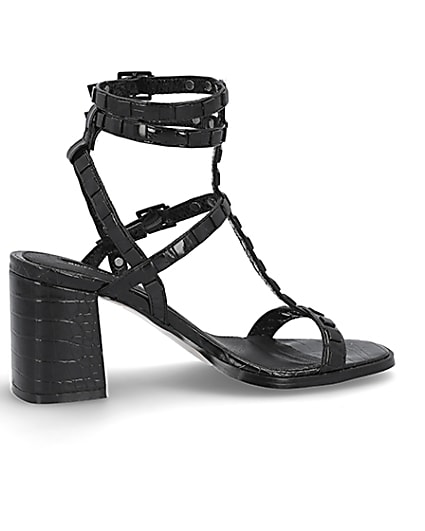 360 degree animation of product Black studded gladiator block heel sandals frame-14