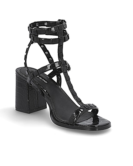 360 degree animation of product Black studded gladiator block heel sandals frame-18