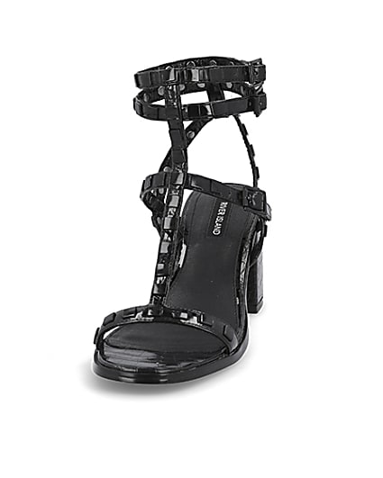 360 degree animation of product Black studded gladiator block heel sandals frame-22