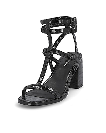 360 degree animation of product Black studded gladiator block heel sandals frame-23