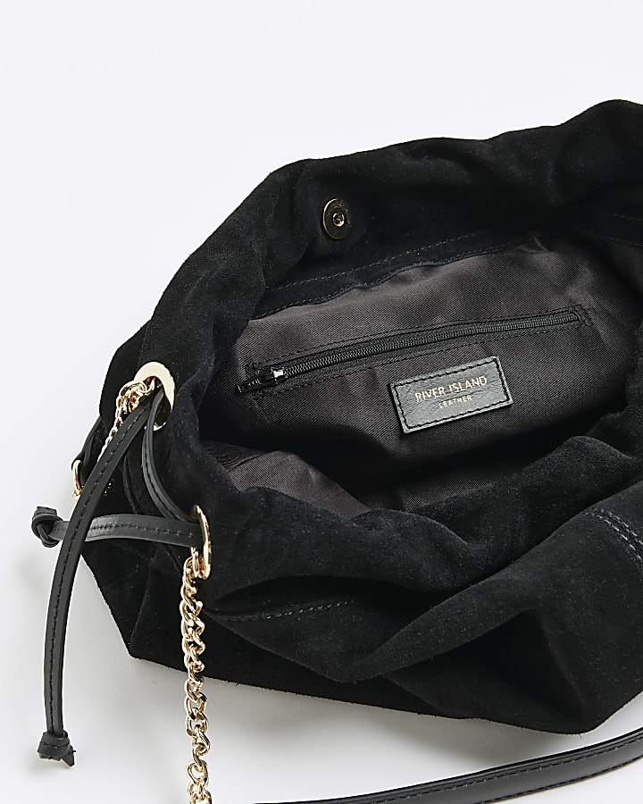 Black suede drawstring shoulder bag