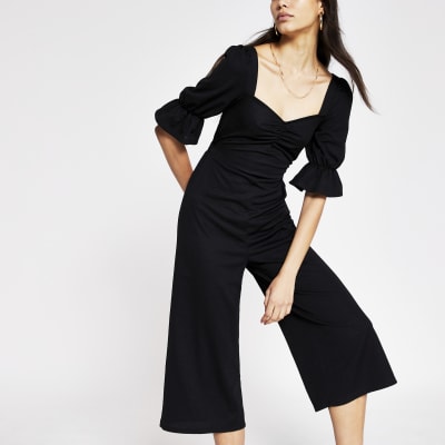 Black sweetheart neck jumpsuit | River Island