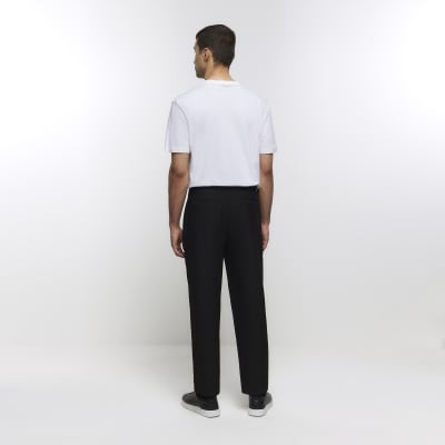 Black tapered fit plisse smart trousers | River Island