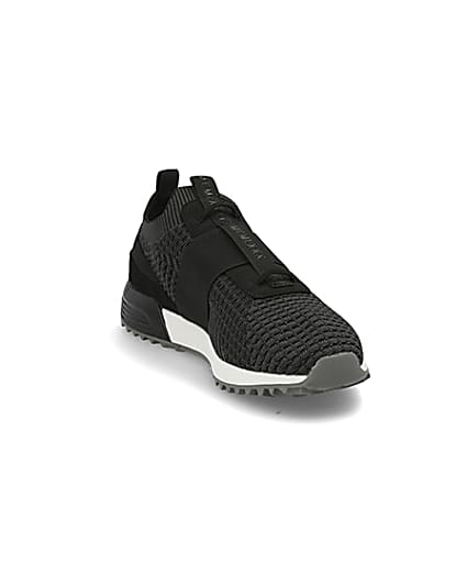 360 degree animation of product Black textured knit runner trainers frame-19