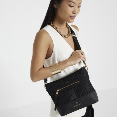 Black webbing quilted cross body bag River Island