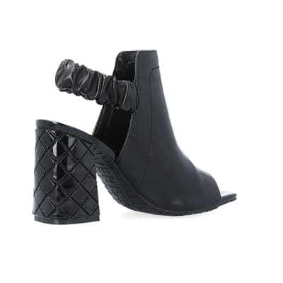 360 degree animation of product Black wide fit heeled ankle boots frame-13