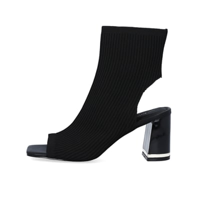 360 degree animation of product Black wide fit knit heeled ankle boots frame-3