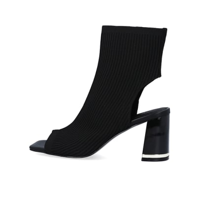 360 degree animation of product Black wide fit knit heeled ankle boots frame-4