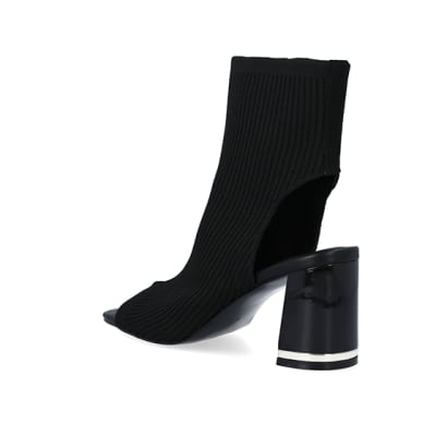 360 degree animation of product Black wide fit knit heeled ankle boots frame-6