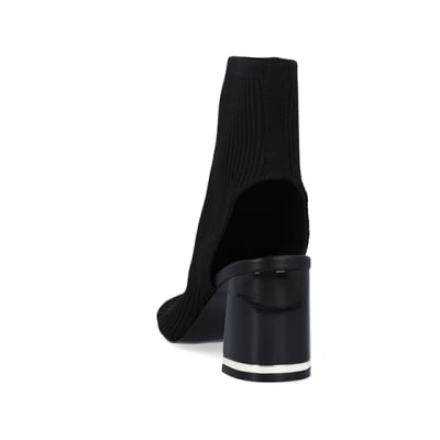 360 degree animation of product Black wide fit knit heeled ankle boots frame-8