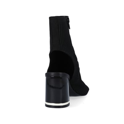 360 degree animation of product Black wide fit knit heeled ankle boots frame-10