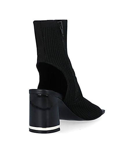 360 degree animation of product Black wide fit knit heeled ankle boots frame-11