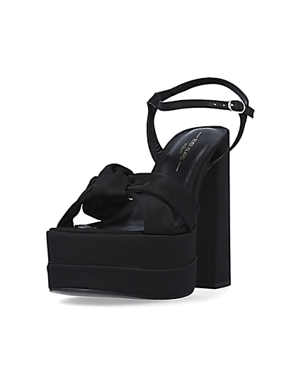 360 degree animation of product Black wide fit knot platform heels frame-23