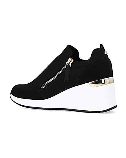 360 degree animation of product Black wide fit slip on wedge trainers frame-5