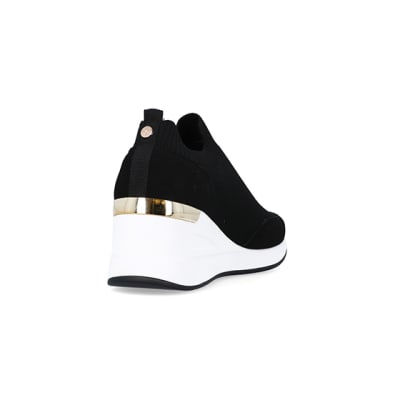 360 degree animation of product Black wide fit slip on wedge trainers frame-11