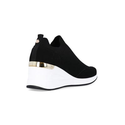 360 degree animation of product Black wide fit slip on wedge trainers frame-12