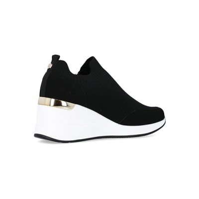 360 degree animation of product Black wide fit slip on wedge trainers frame-13