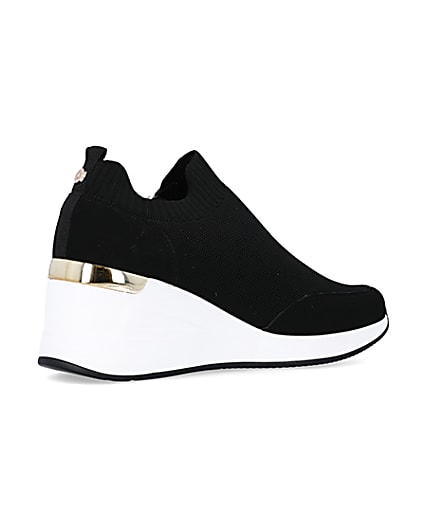360 degree animation of product Black wide fit slip on wedge trainers frame-13