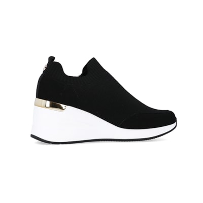 360 degree animation of product Black wide fit slip on wedge trainers frame-14