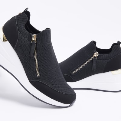 Black wide fit slip on wedge trainers | River Island