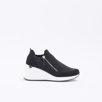 Black wide fit slip on wedge trainers | River Island