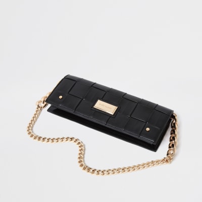 black woven clutch bag